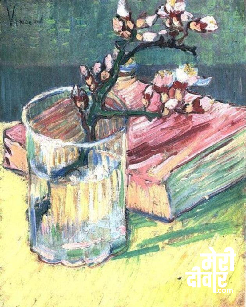 Blossoming almond branch in a glass with a book